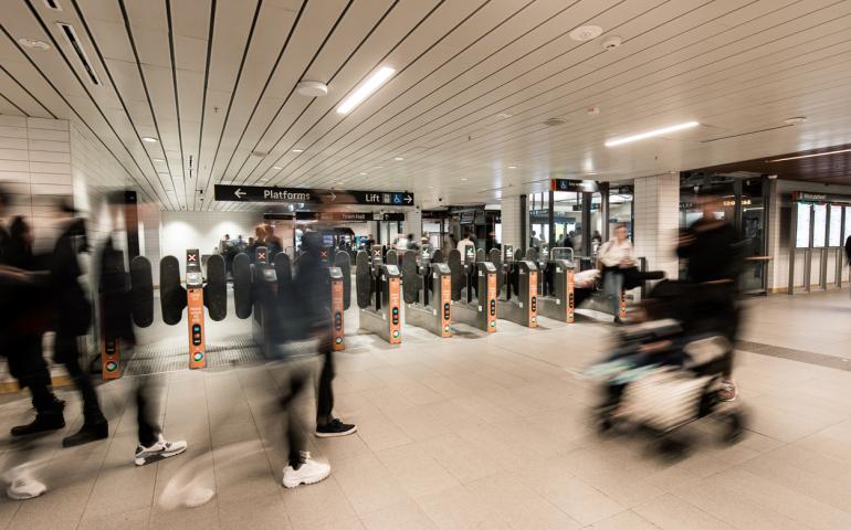 Pictured - blurred people in a busy train station 
